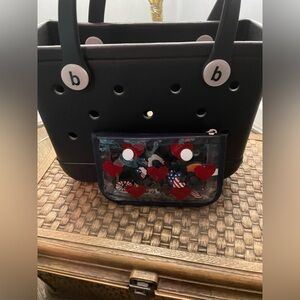 Bogg bitty bag, the tote has charms included